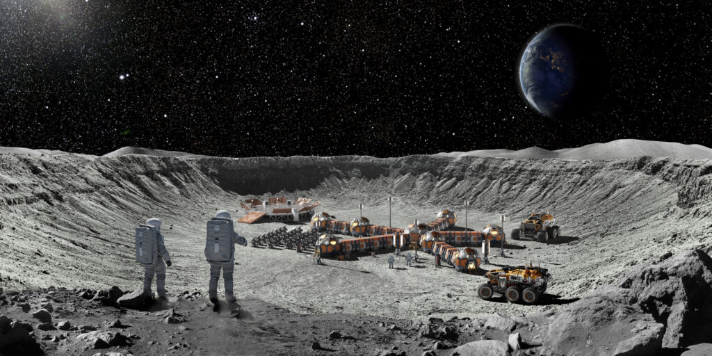 Two Astronauts On Moon Looking At Moon Base From Crater Edge